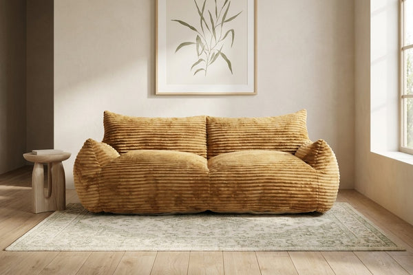 Canapé pouf Pola Duo caramel dans un salon lumineux
