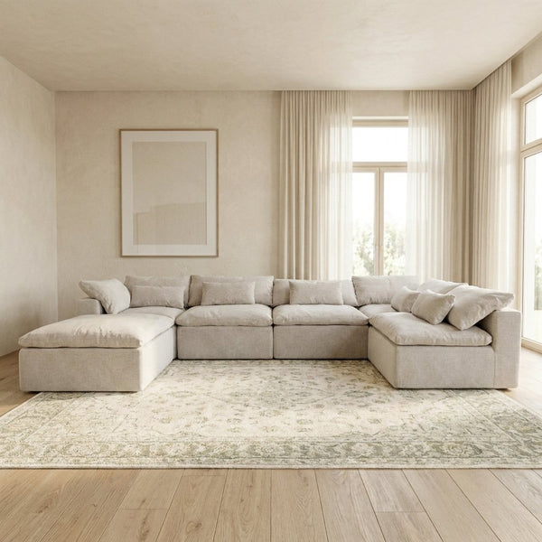Canapé modulable Vela 6 modules blanc crème dans un salon lumineux