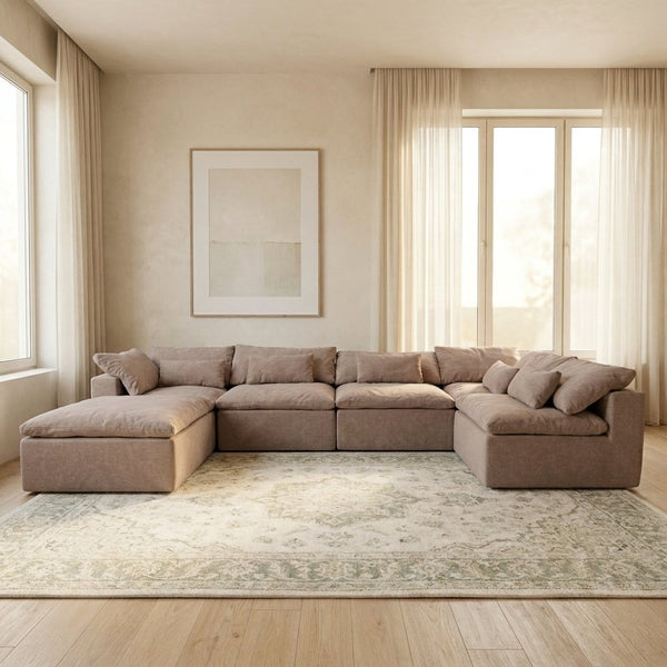 Canapé modulable Vela 6 modules vieux rose dans un salon lumineux