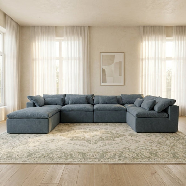 Canapé modulable Vela 6 modules bleu orage dans un salon lumineux